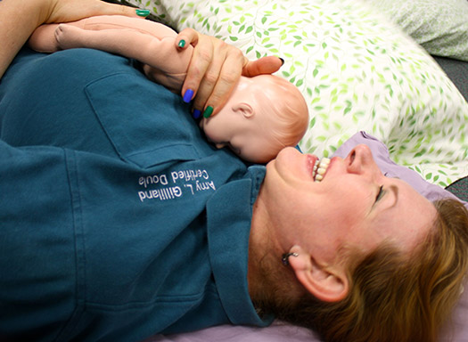 Amy Holding Newborn Baby Doll During Childbirth Class
