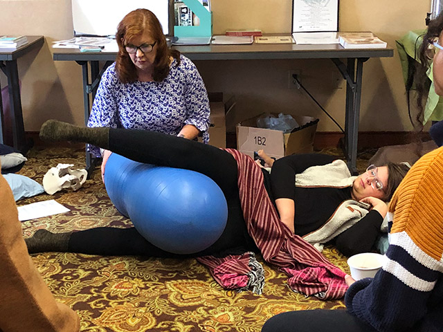 Amy Training Aspiring Doula With Birthing Ball